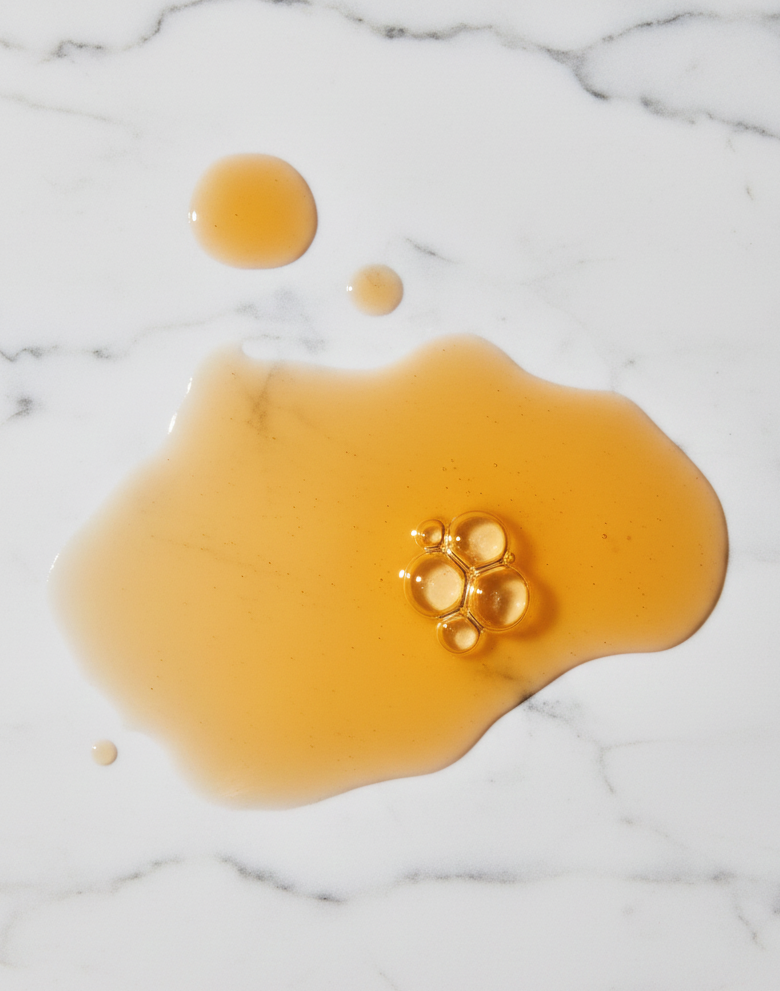 Honey droplets on marble